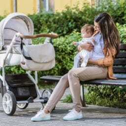 Women with a Baby Siting Outsite